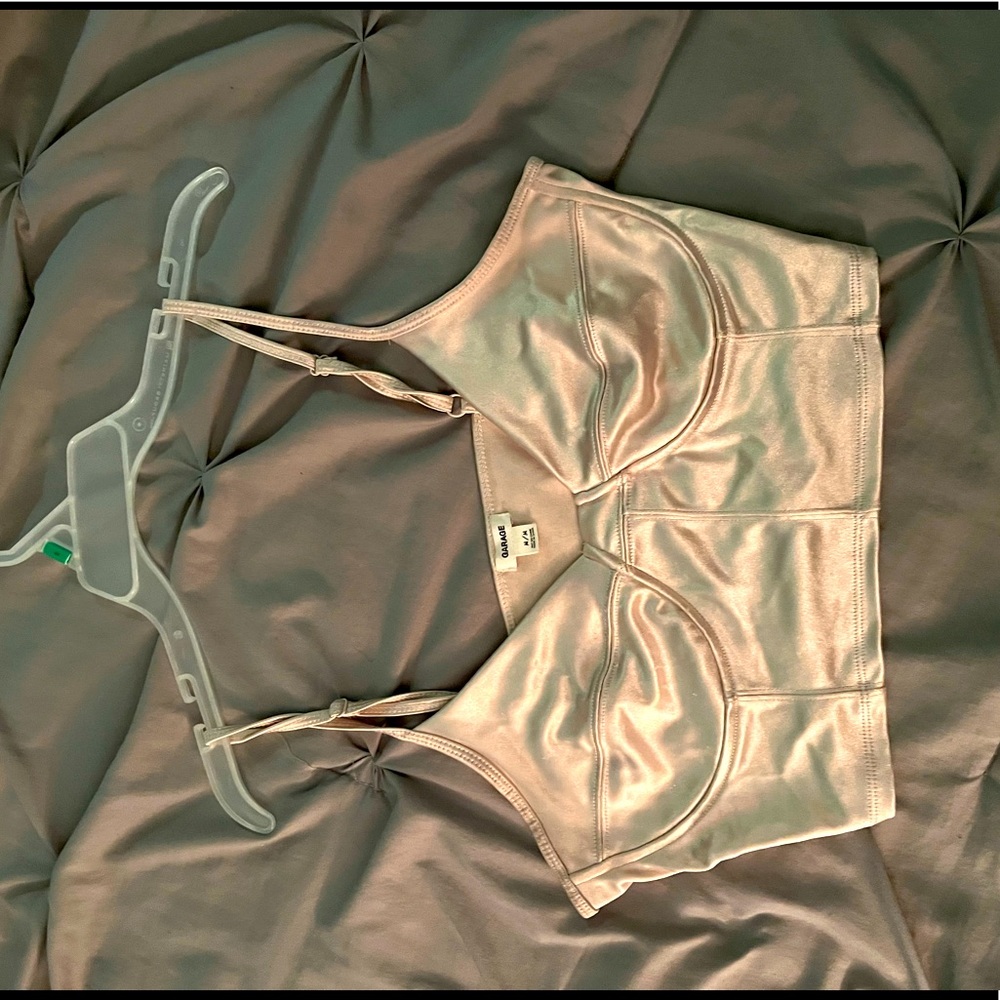 Silver/cream metallic tank top. From the garage and is a size medium.